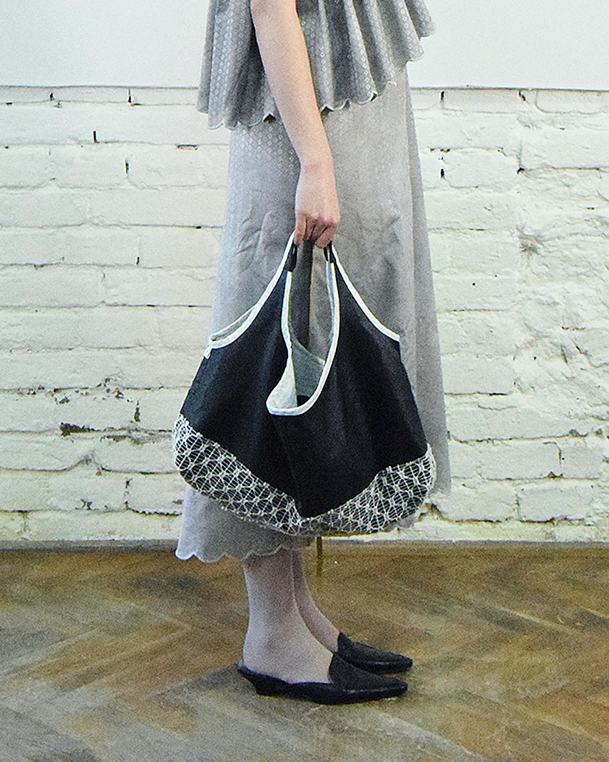 Black leather and lace bag