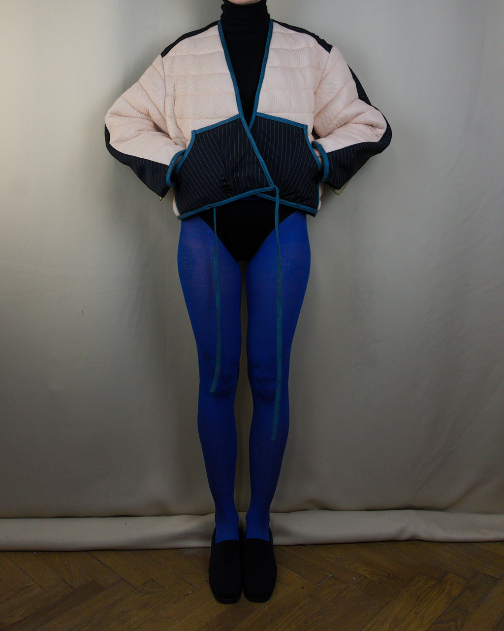 Light pink and black layered puffer jacket