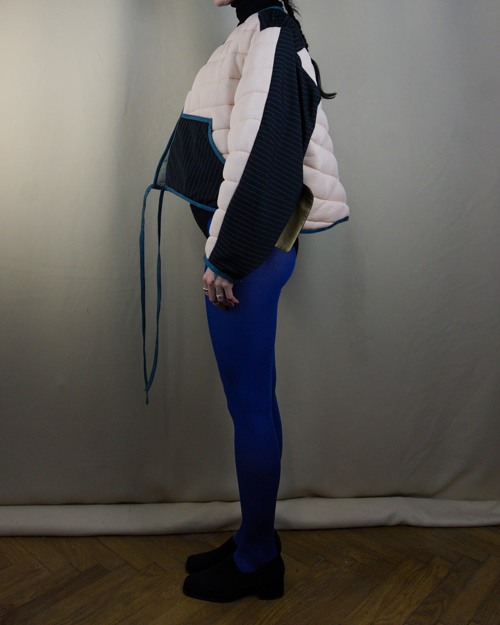 Light pink and black layered puffer jacket