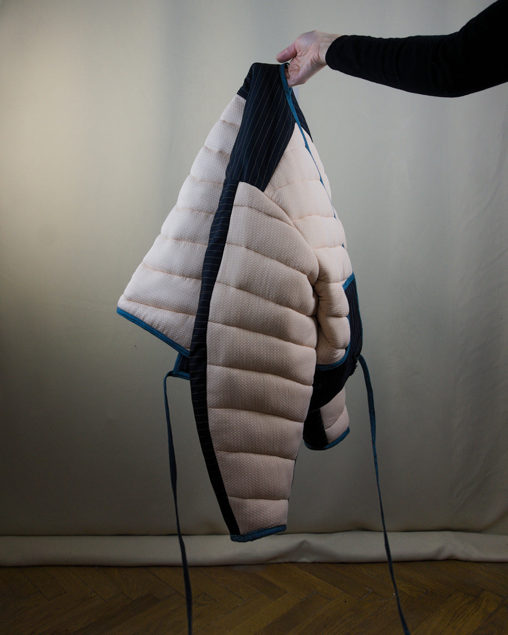 Light pink and black layered puffer jacket