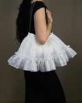 White ruffled bag