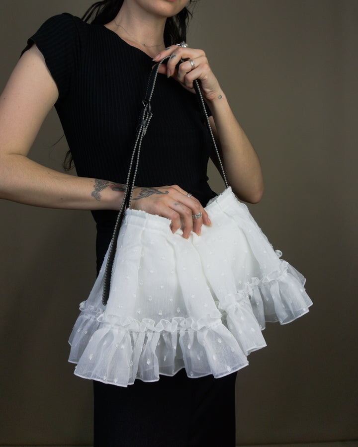 White ruffled bag