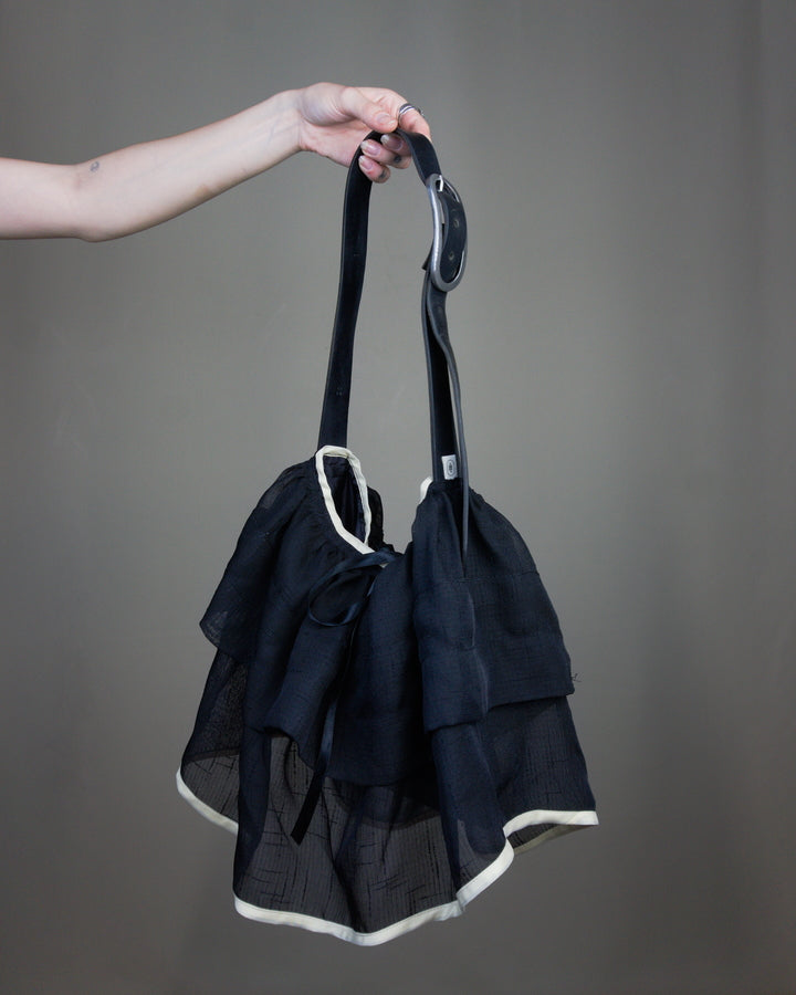 Black ruffled bag