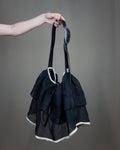 Black ruffled bag