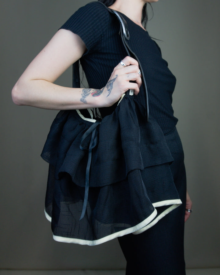 Black ruffled bag