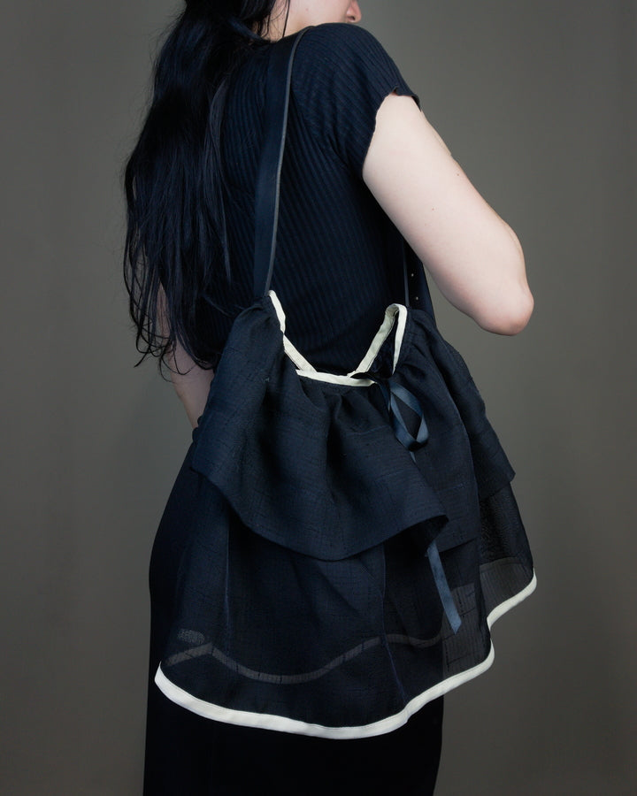 Black ruffled bag