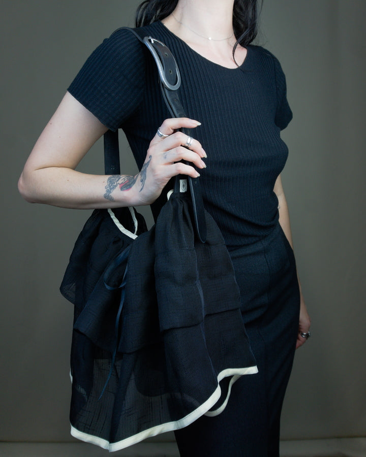 Black ruffled bag