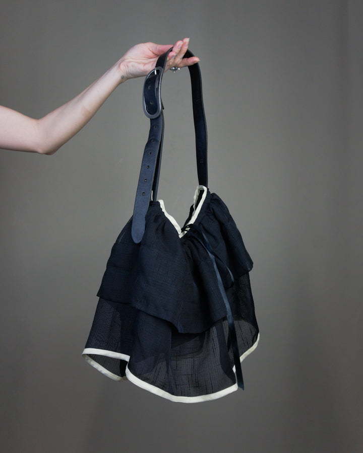 Black ruffled bag